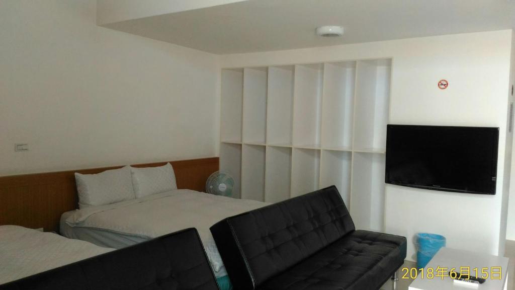 Postel nebo postele na pokoji v ubytování SKY square Homestay