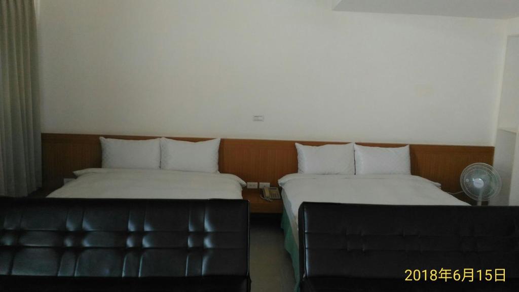 Postel nebo postele na pokoji v ubytování SKY square Homestay