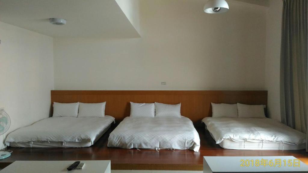 Postel nebo postele na pokoji v ubytování SKY square Homestay