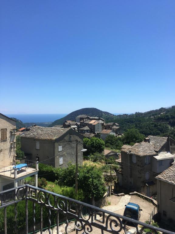 a view of a town from the balcony of a house at Appartement 2 chambres A Casa De Giovanni à Pietra-di-Verde en Haute-Corse in Pietra-di-Verde