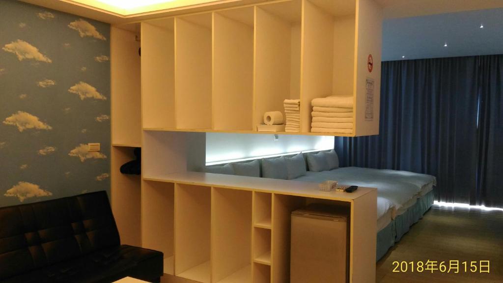 Postel nebo postele na pokoji v ubytování SKY square Homestay