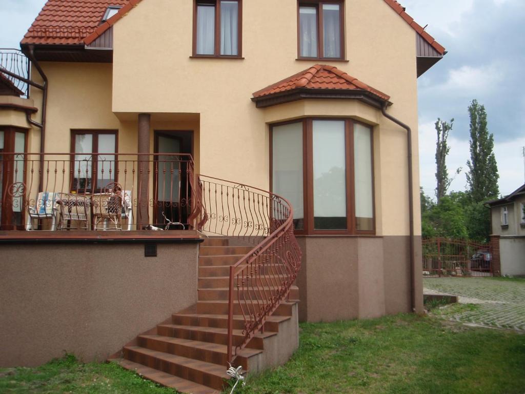 a house with a staircase in front of it at Willa Bursztyn Gdansk in Gdańsk