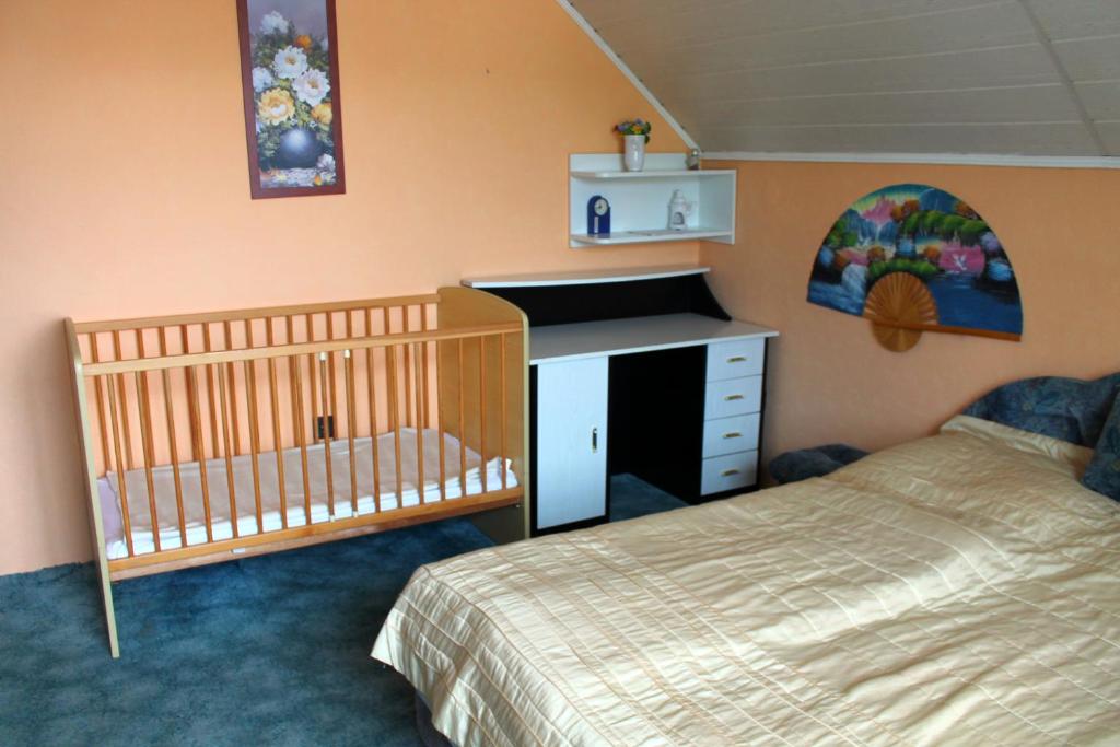 Postel nebo postele na pokoji v ubytování Ibolya Apartmanok