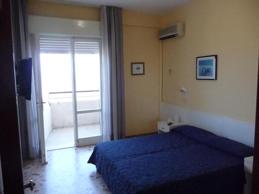 Postel nebo postele na pokoji v ubytování Hotel David