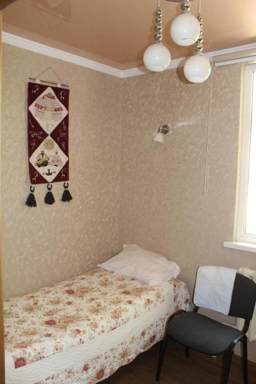 Postel nebo postele na pokoji v ubytování Tian-Shan Guest House