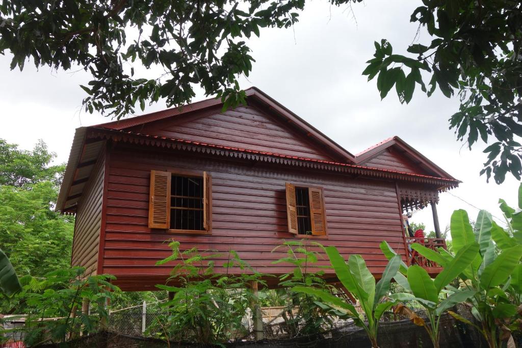 an old house in the middle of a forest at Authentic Cambodian Angkor Cottage in Siem Reap