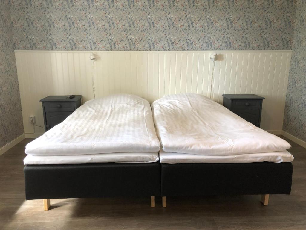 Postel nebo postele na pokoji v ubytování Helsingegården