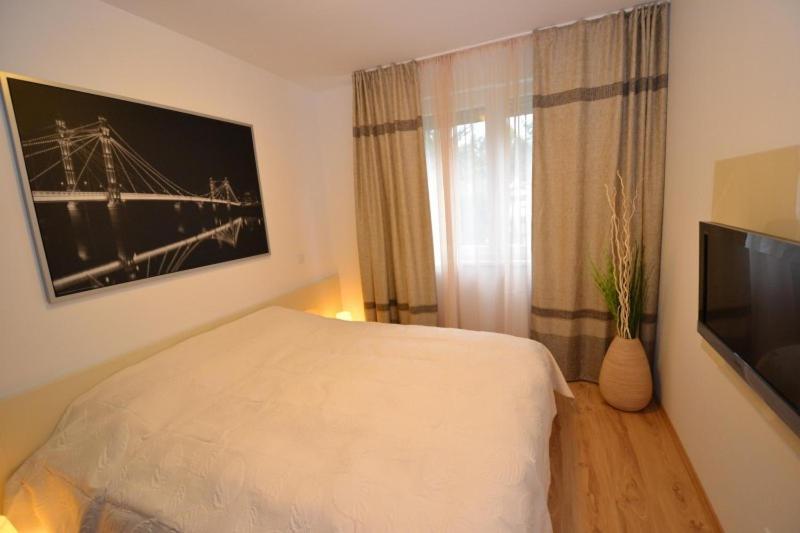 Televízia a/alebo spoločenská miestnosť v ubytovaní Hannah apartman Siófok