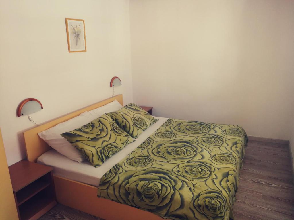 Postel nebo postele na pokoji v ubytování Apartments Ani