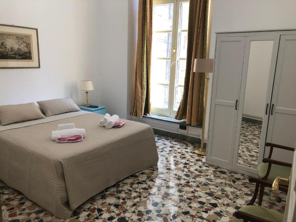 Posteľ alebo postele v izbe v ubytovaní Nunziata Apartment