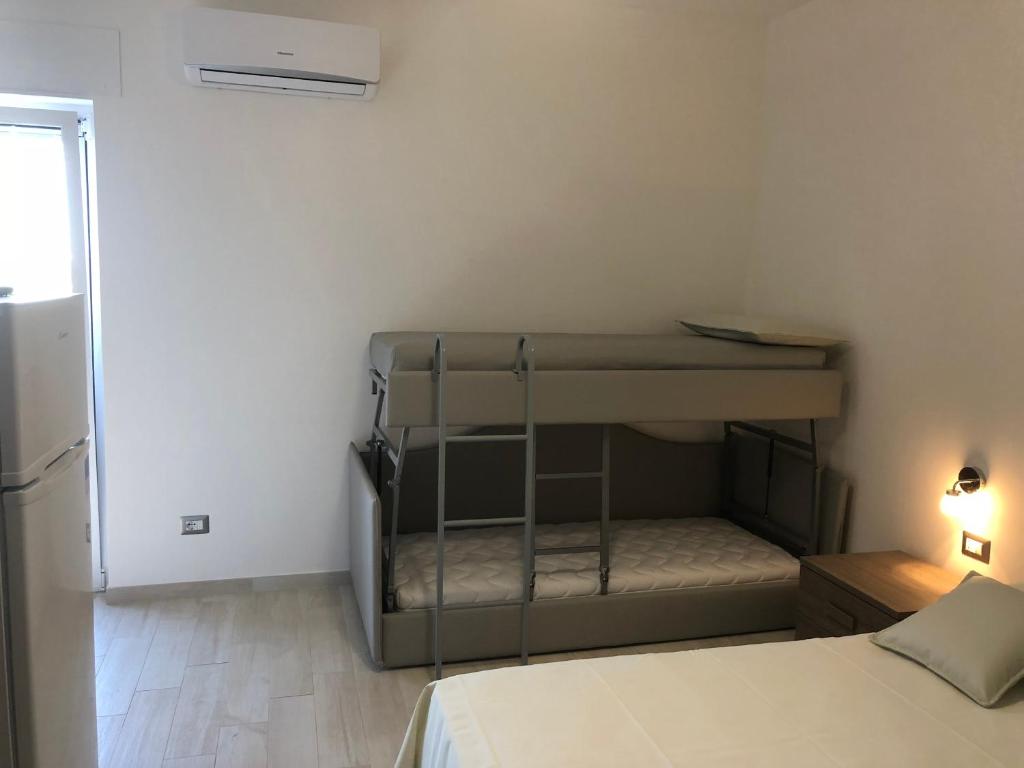 Postel nebo postele na pokoji v ubytování Casa Profumi di Puglia