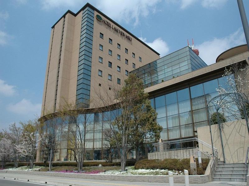 a large office building with a building at Hotel Lake View Mito in Mito