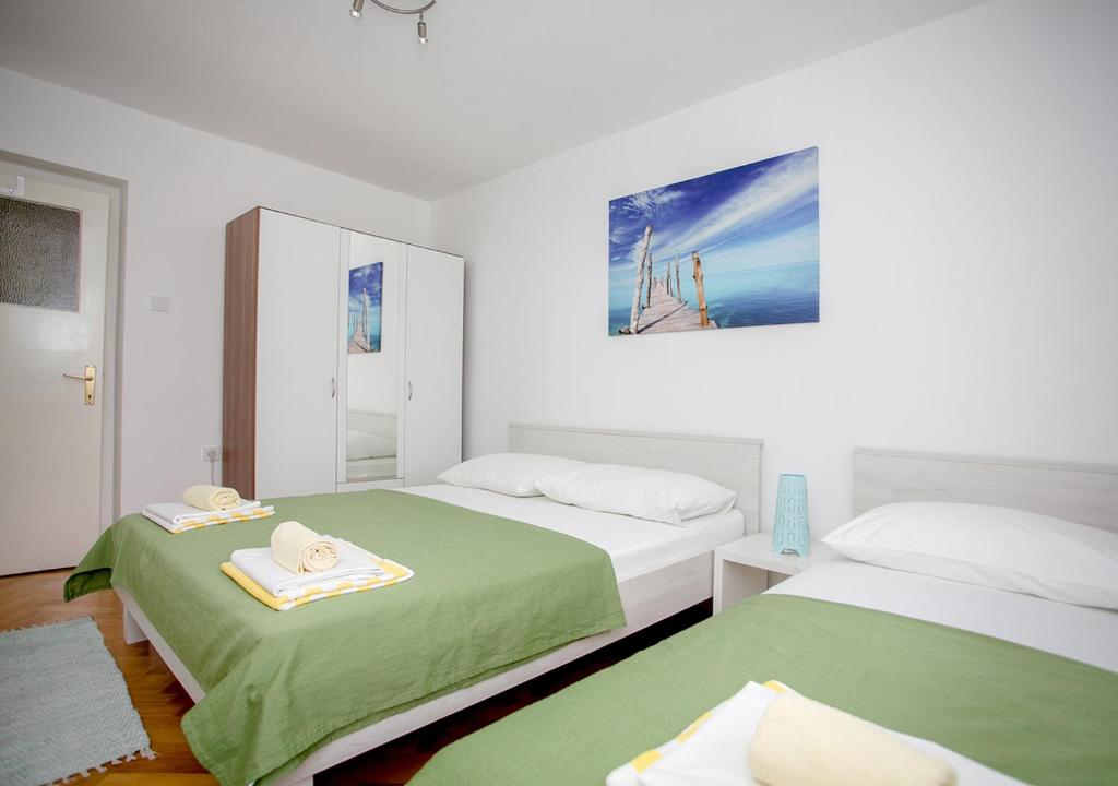 Posteľ alebo postele v izbe v ubytovaní Apartment Omiš Holiday