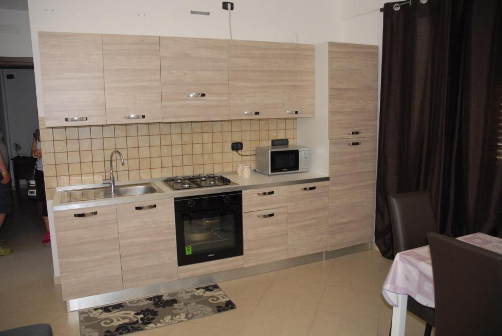 A kitchen or kitchenette at Oasi Tortuga Residence Piscina e barbecue h24