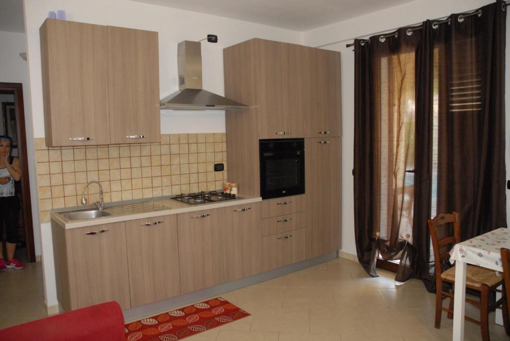 A kitchen or kitchenette at Oasi Tortuga Residence Piscina e barbecue h24