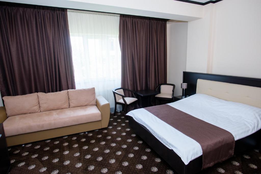 Postel nebo postele na pokoji v ubytování Hotel Maryiotis