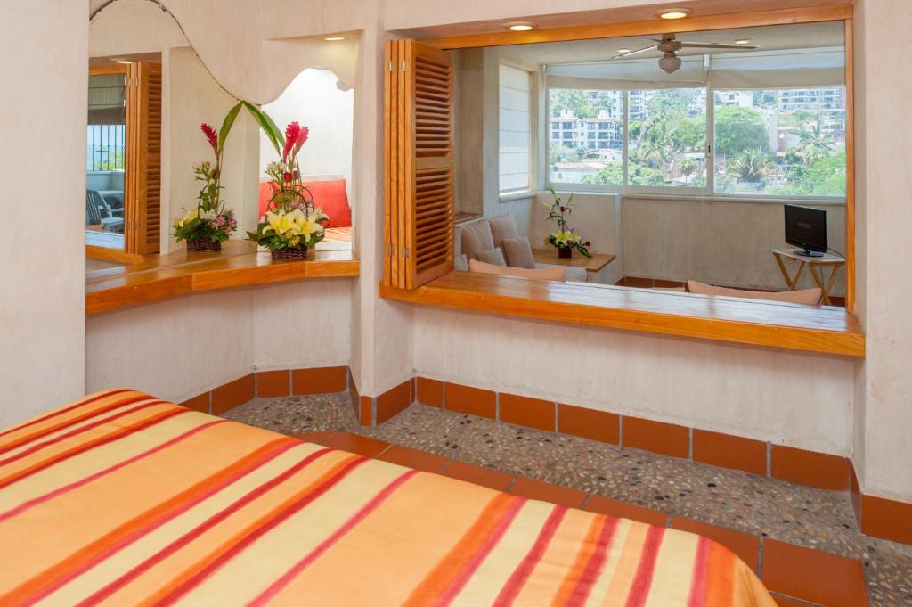 Postel nebo postele na pokoji v ubytování Hotel Eloisa