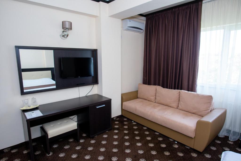 TV a/nebo společenská místnost v ubytování Hotel Maryiotis