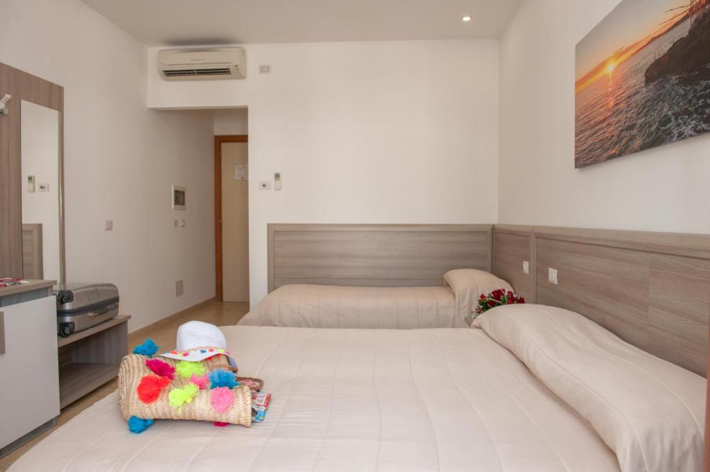 Letto o letti in una camera di Albergo San Giorgio
