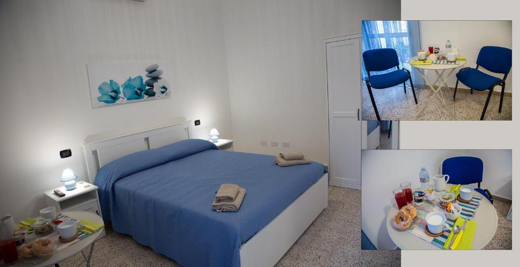 格拉尼亞諾的住宿－Home OLY，卧室配有一张床和一张桌子及椅子
