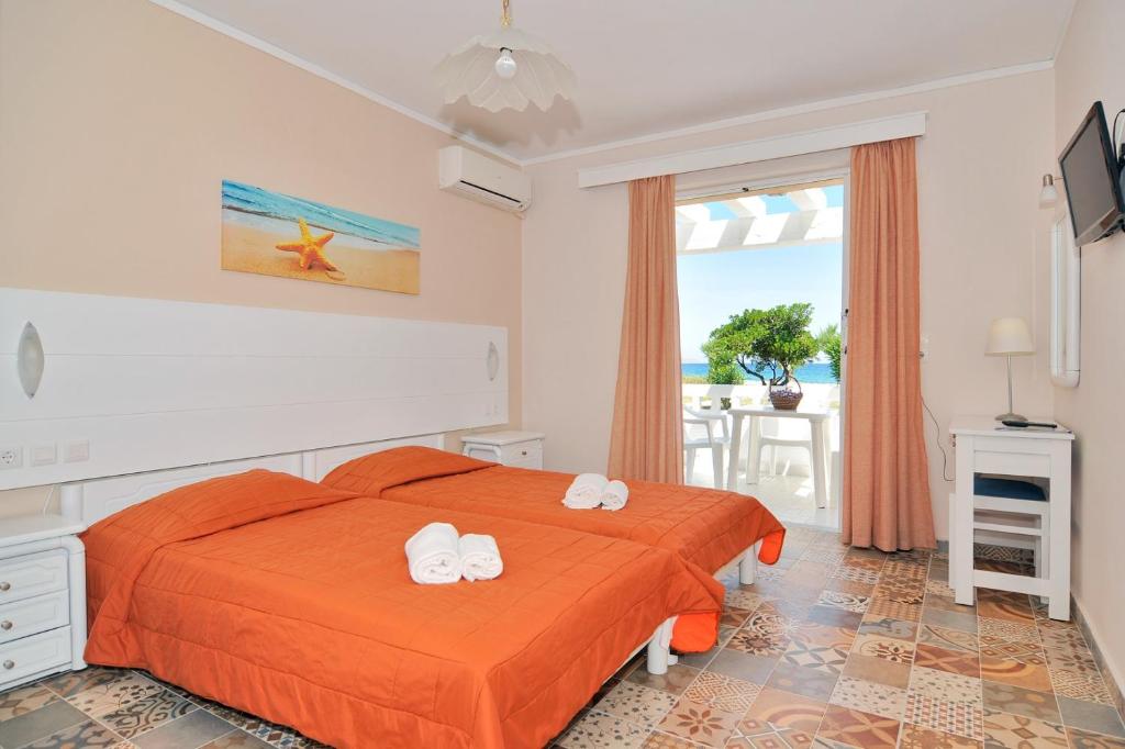 Postel nebo postele na pokoji v ubytování Byron Apartments