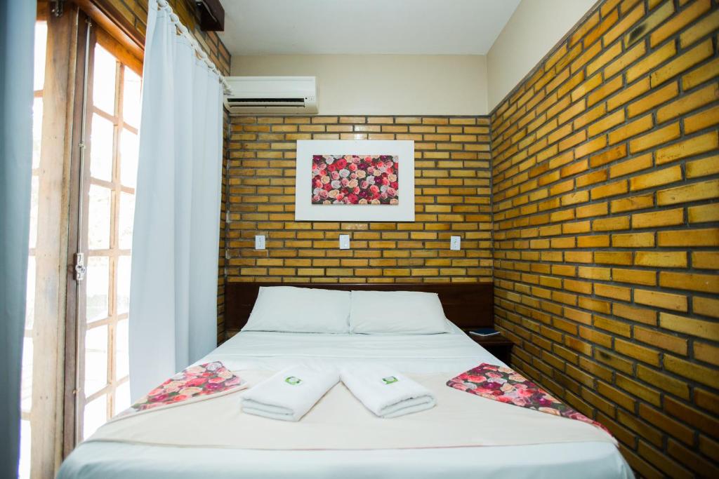 Cama ou camas em um quarto em Hotel D'Luz