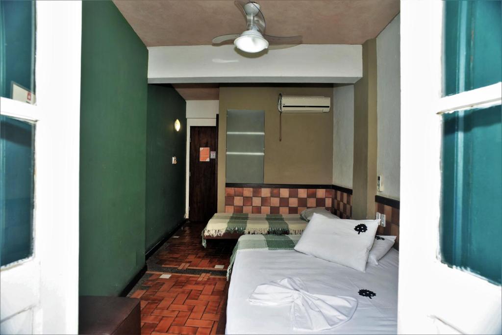 Postel nebo postele na pokoji v ubytování Laranjeiras Hostel