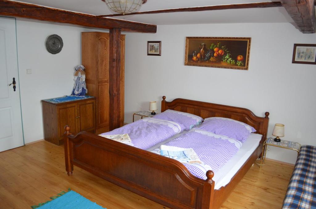 Postel nebo postele na pokoji v ubytování Čapkův statek
