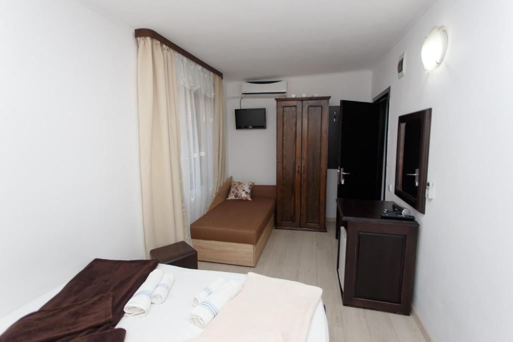 Postel nebo postele na pokoji v ubytování Vila Sandra