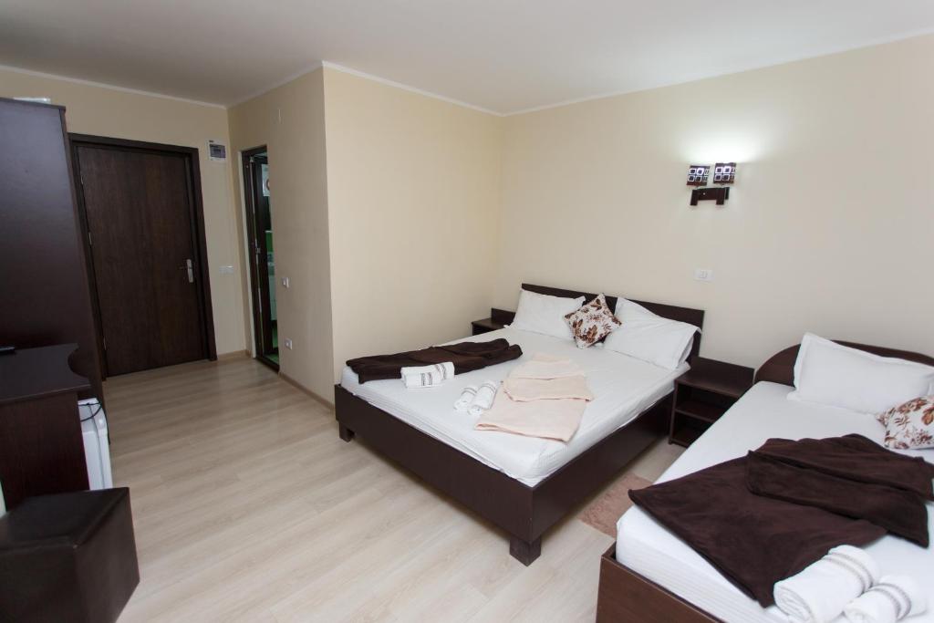 Postel nebo postele na pokoji v ubytování Vila Sandra