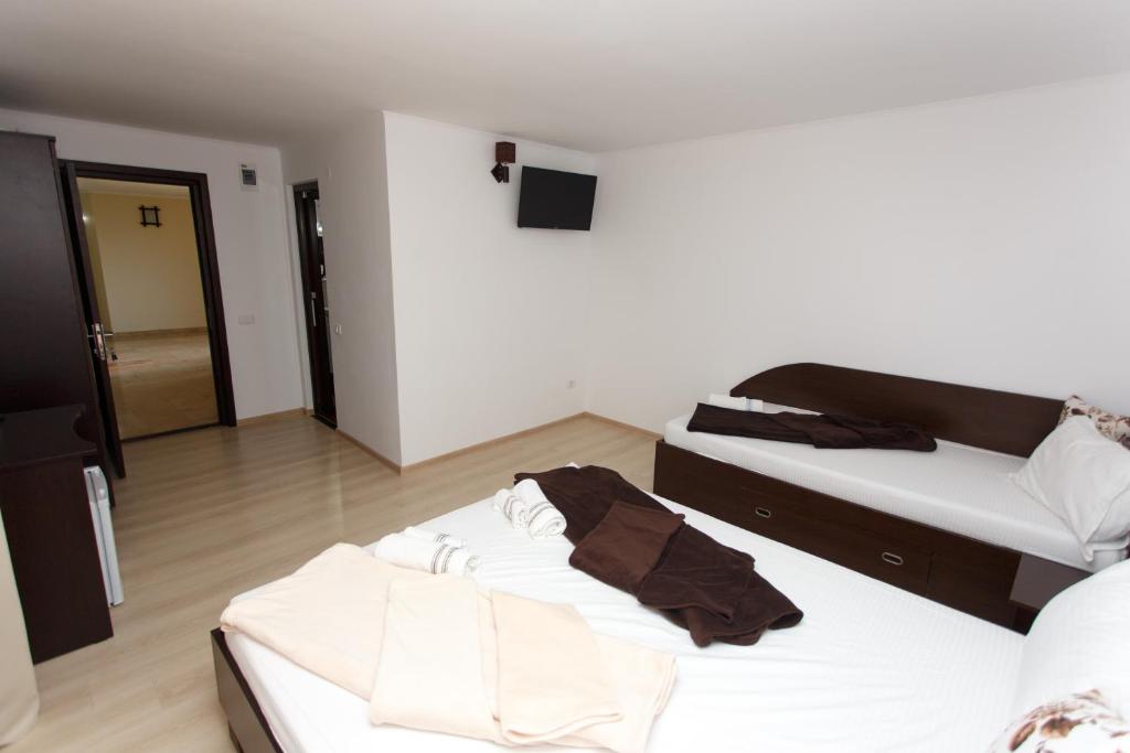 Postel nebo postele na pokoji v ubytování Vila Sandra