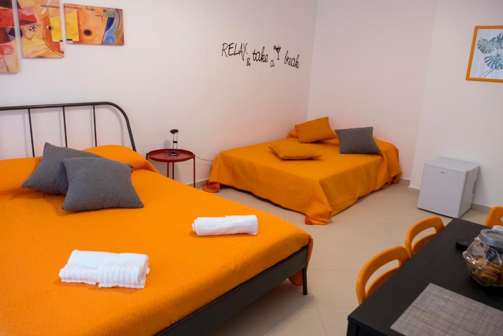 Postel nebo postele na pokoji v ubytování Enjoy Trani