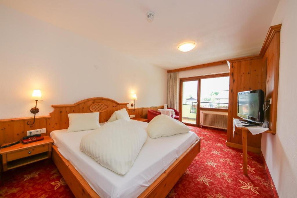 Posteľ alebo postele v izbe v ubytovaní Hotel Dax