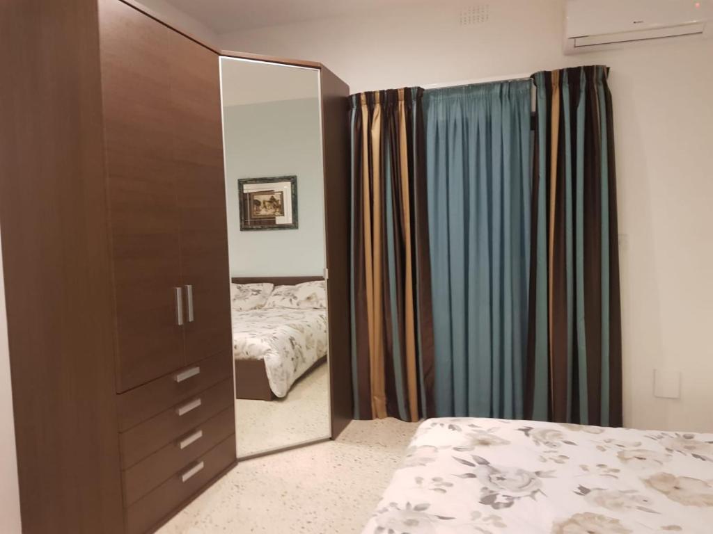 Postel nebo postele na pokoji v ubytování Merhba APT 3