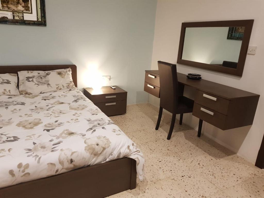 Postel nebo postele na pokoji v ubytování Merhba APT 3