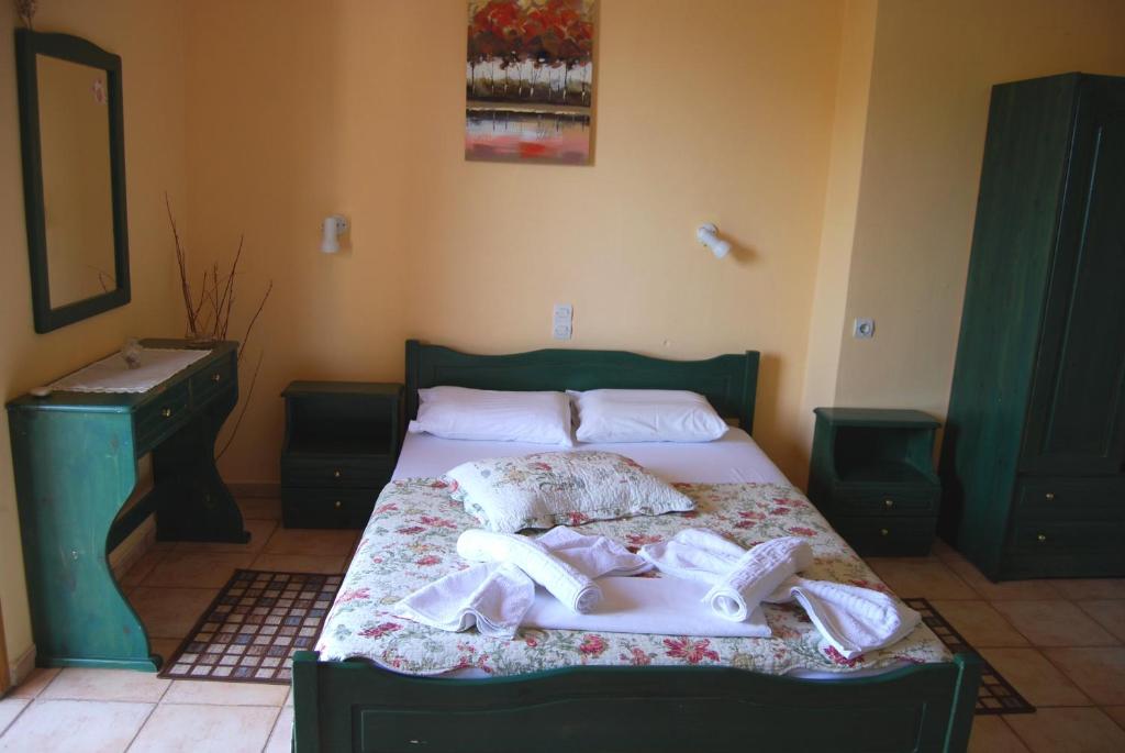 Postel nebo postele na pokoji v ubytování Golden Sun Apartments