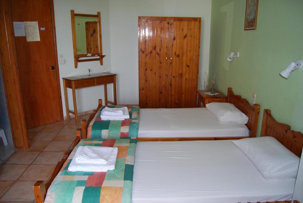 Postel nebo postele na pokoji v ubytování Golden Sun Apartments