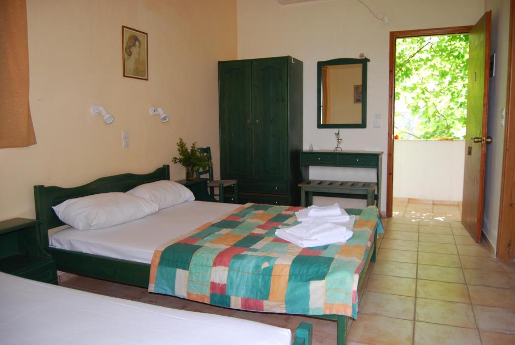 Postel nebo postele na pokoji v ubytování Golden Sun Apartments