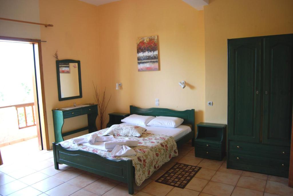 Postel nebo postele na pokoji v ubytování Golden Sun Apartments