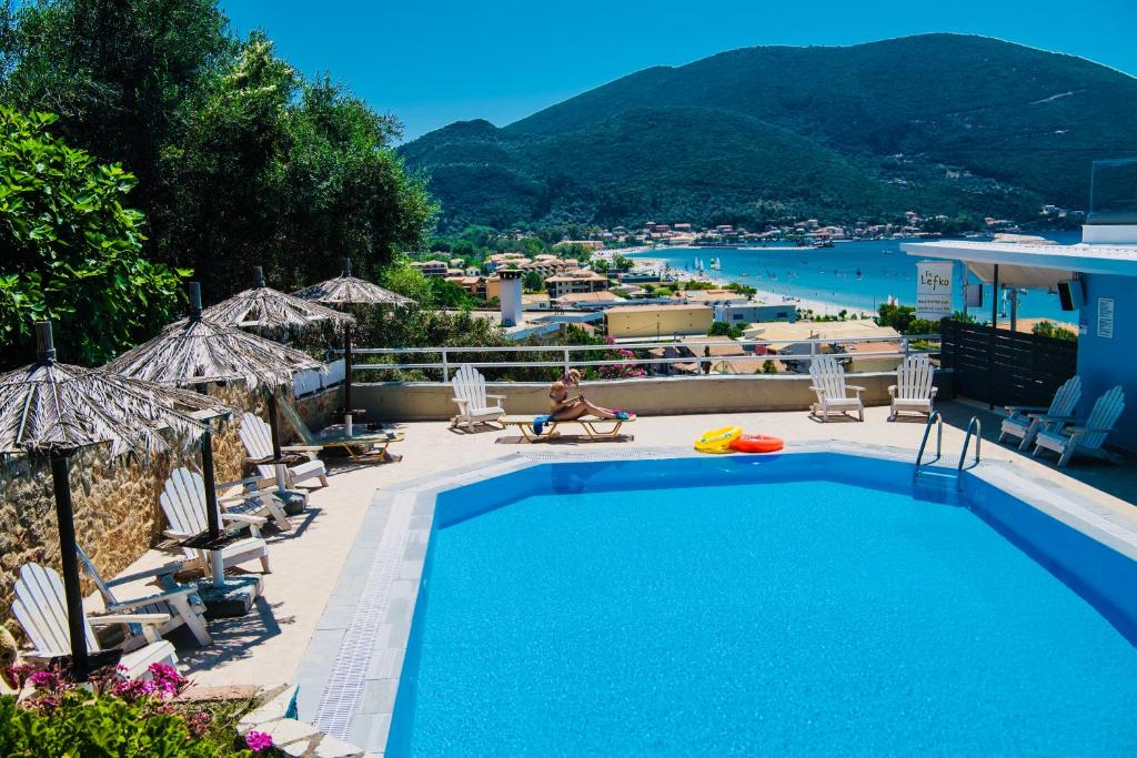 a swimming pool with a view of a resort at Ponti Beach Hotel in Vasiliki
