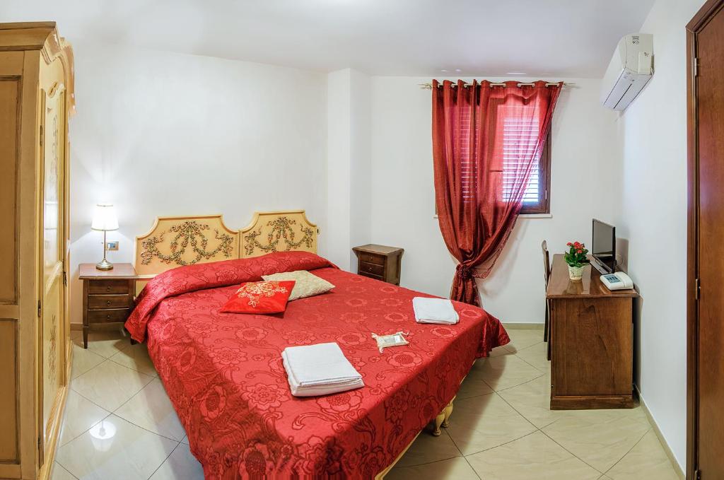 Postel nebo postele na pokoji v ubytování Garibaldi Relais