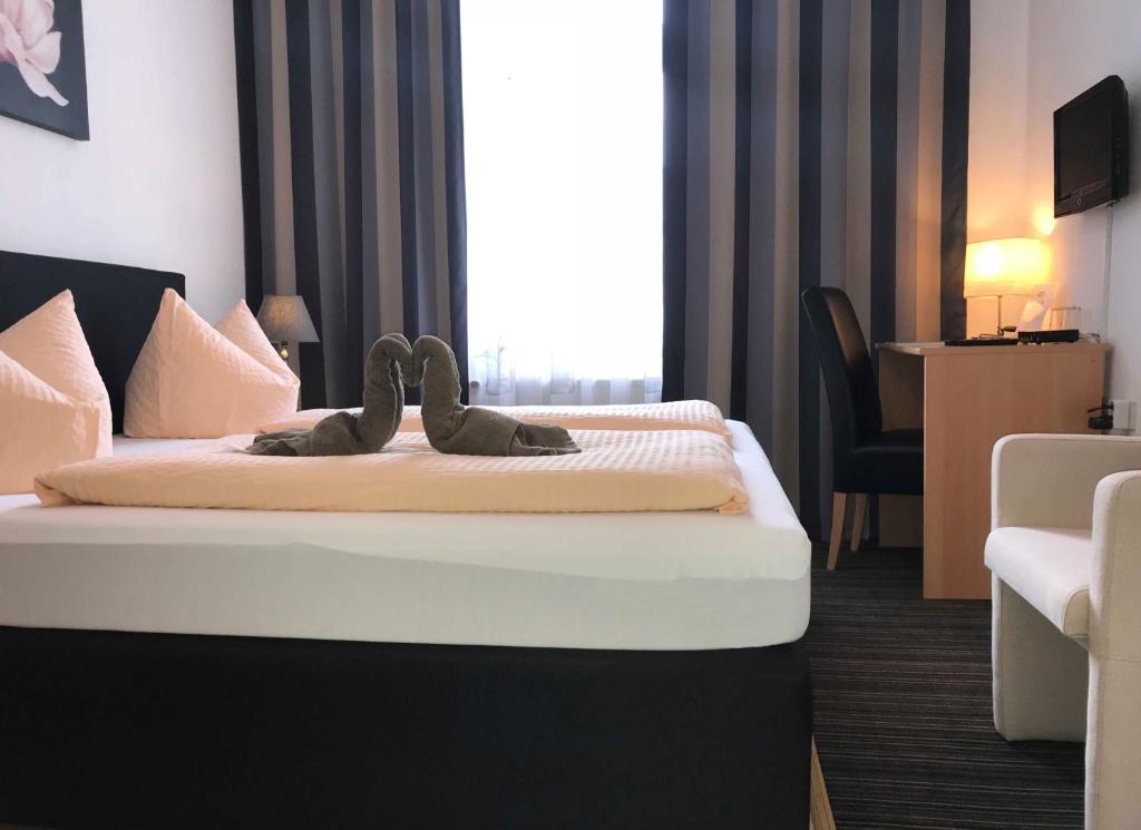 Postel nebo postele na pokoji v ubytování Hotel Antoni