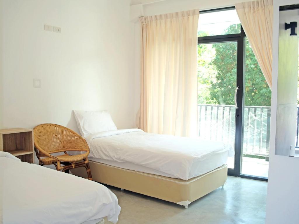 Postel nebo postele na pokoji v ubytování The Dearly Koh Tao Hostel-PADI 5 Star Dive Resort