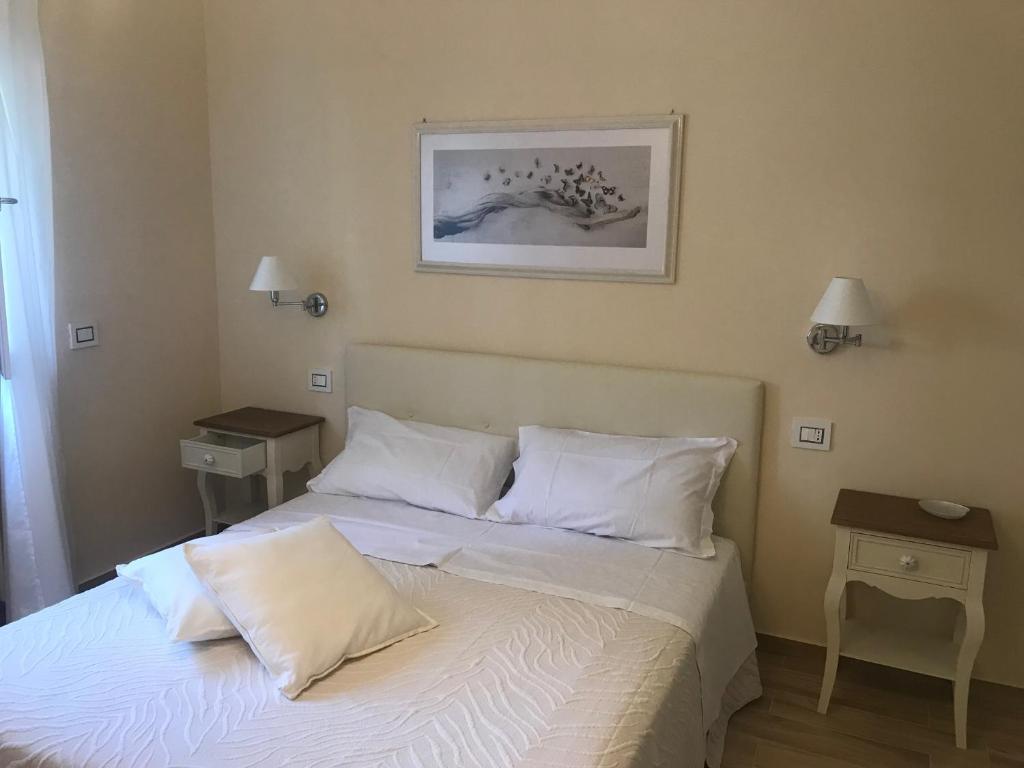 Postel nebo postele na pokoji v ubytování L’OPERÀ
