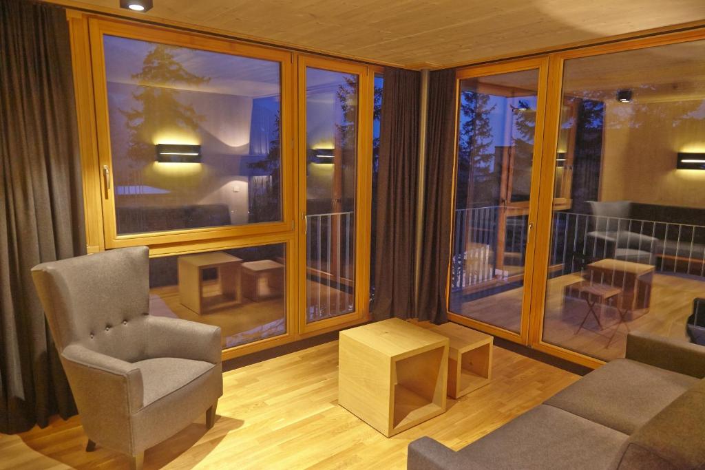 Posezení v ubytování Gradonna Mountain Resort Chalets & Hotel