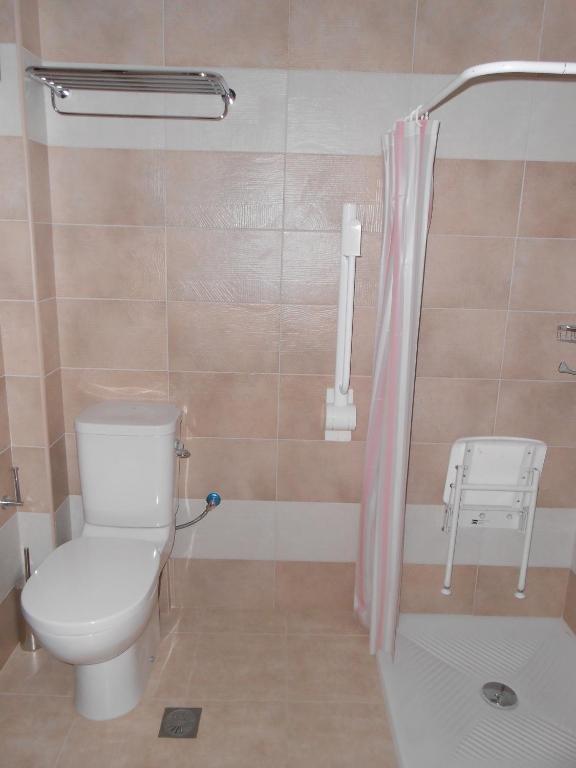 a bathroom with a toilet and a shower at Element Hotel in Elafonisos