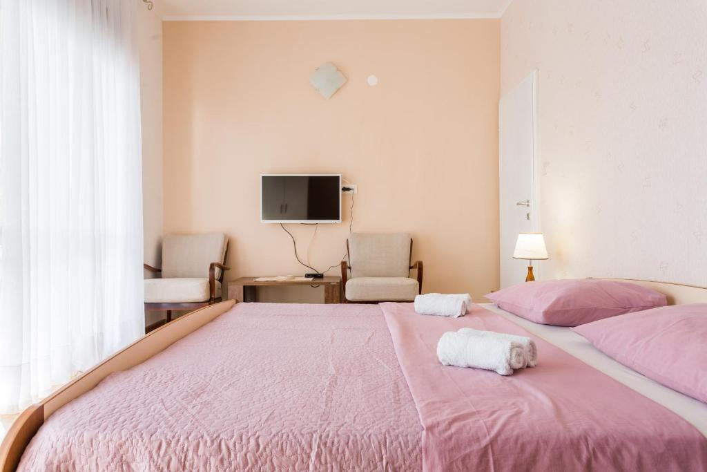 Postel nebo postele na pokoji v ubytování Guest house "Litus"