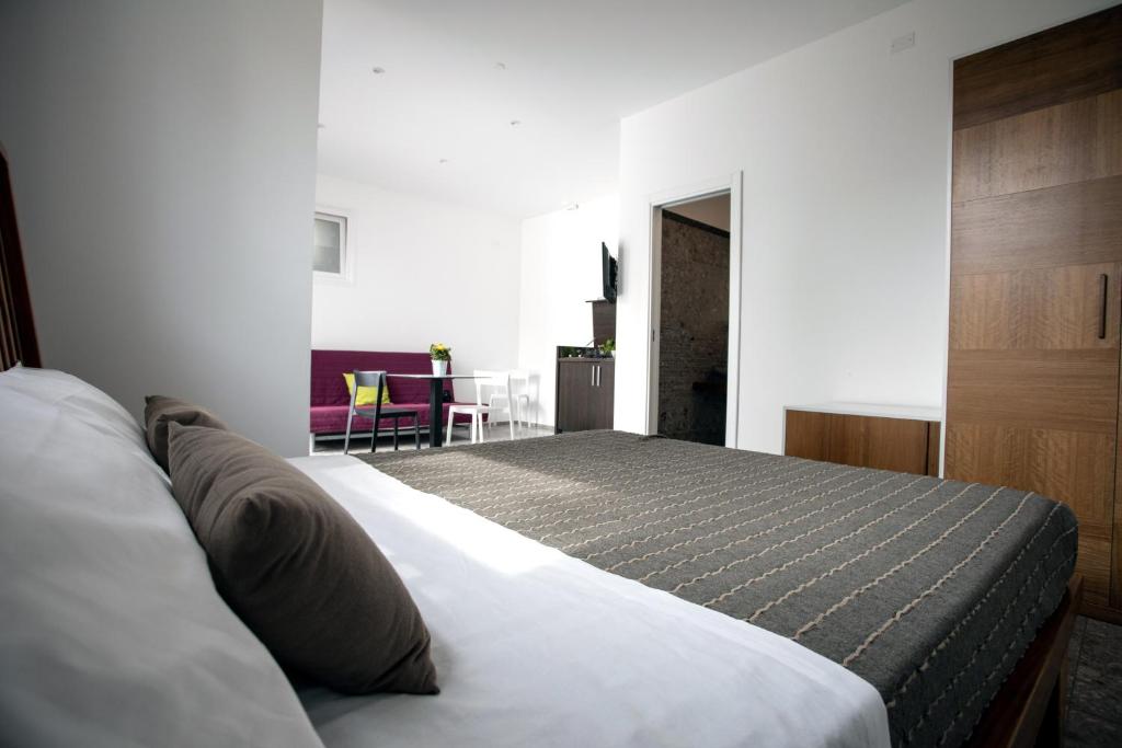 Hotel Torre Santamaria Resortにあるベッド