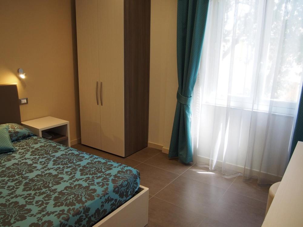Postel nebo postele na pokoji v ubytování Endro's Rooms