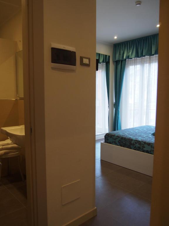 Postel nebo postele na pokoji v ubytování Endro's Rooms
